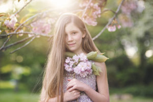 Portrait of girl in spring blossom by Moira Lizzie Photography
