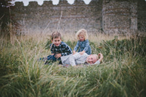 Three siblings at Portchester Castle by Moira Lizzie Photography