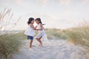Sisters dancing in the dunes at East Head, West Wittering